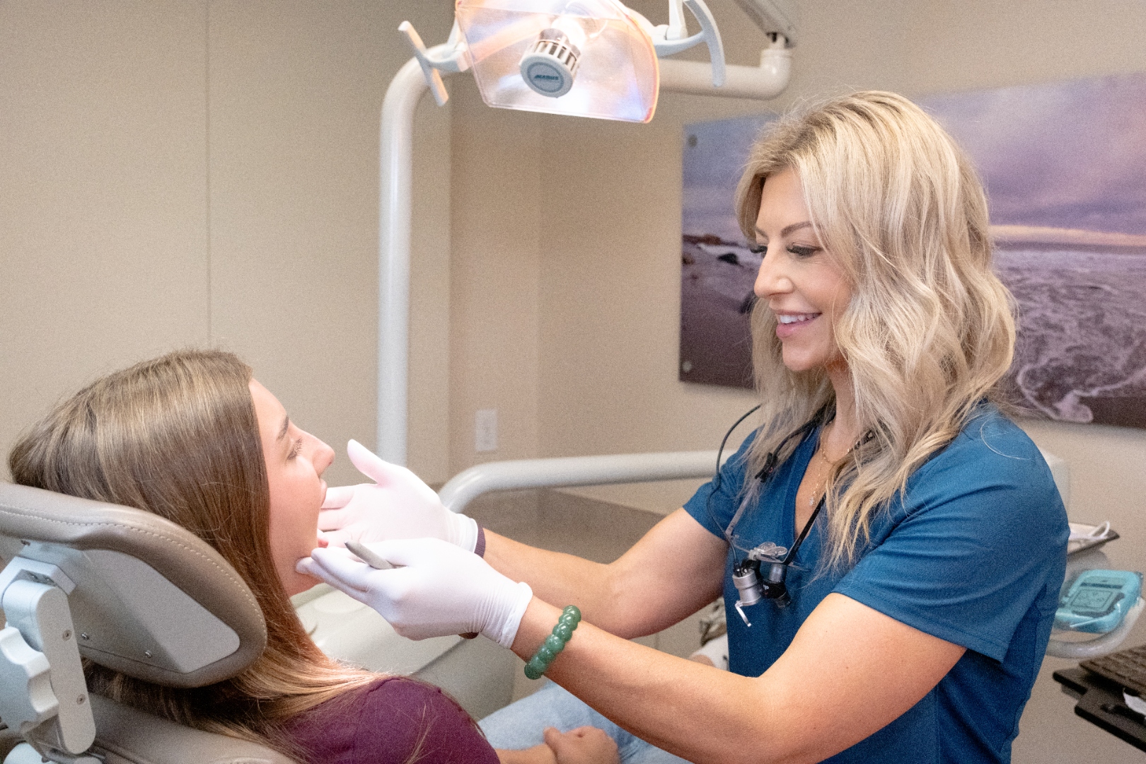 Brenda Powers examining a young patient with precision and care